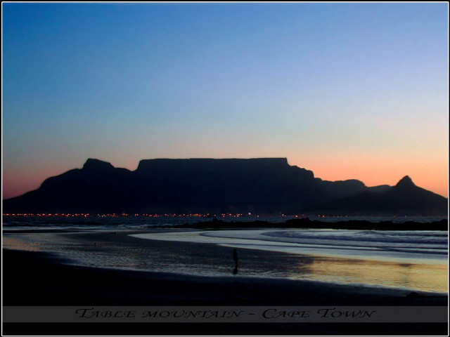 Beach sunset mountain city person free wallpaper for desktop - medium preview image