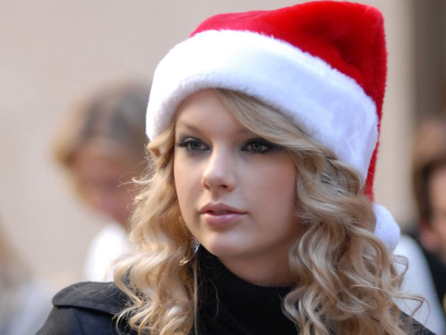 Woman santa hat serious look free wallpaper for desktop - medium preview image