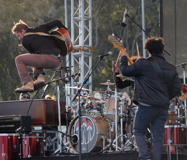 Man jumping guitar stage performance free wallpaper for desktop - medium preview image