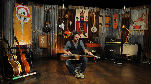 Man chair guitar room guitars free wallpaper for desktop - medium preview image