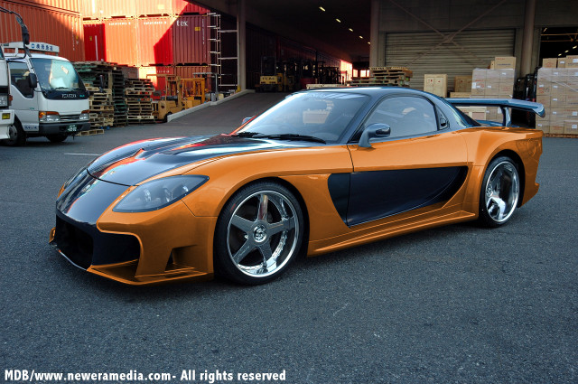Sports car parking lot truck free wallpaper for desktop - medium preview image