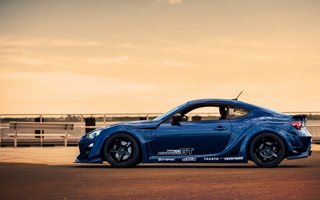 Blue sports car road fence #3 free wallpaper for desktop - medium preview image