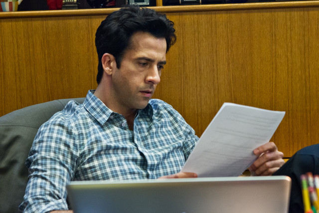 Man sitting laptop holding paper free wallpaper for desktop - medium preview image