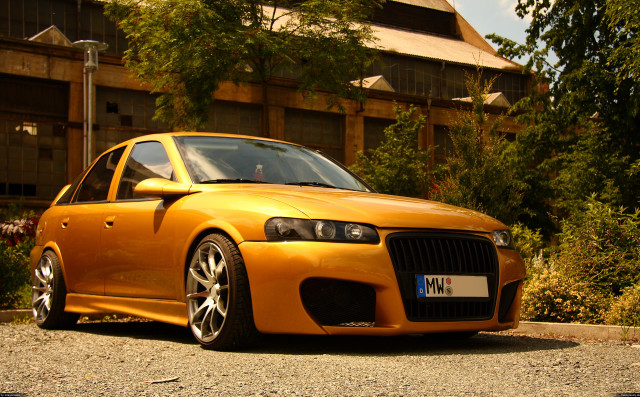 Yellow car parked building clock free wallpaper for desktop - medium preview image