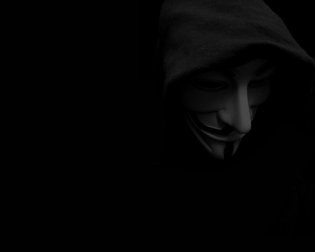 Masked hooded person dark cellphone free wallpaper for desktop - medium preview image