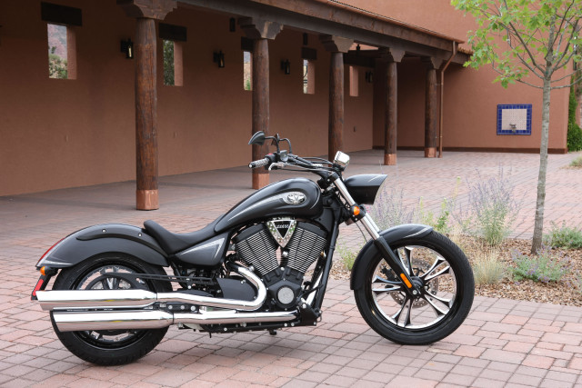 Motorcycle parked brick sidewalk building free wallpaper for desktop - medium preview image