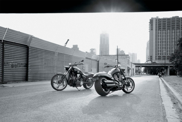 Motorcycles parked road fence building free wallpaper for desktop - medium preview image