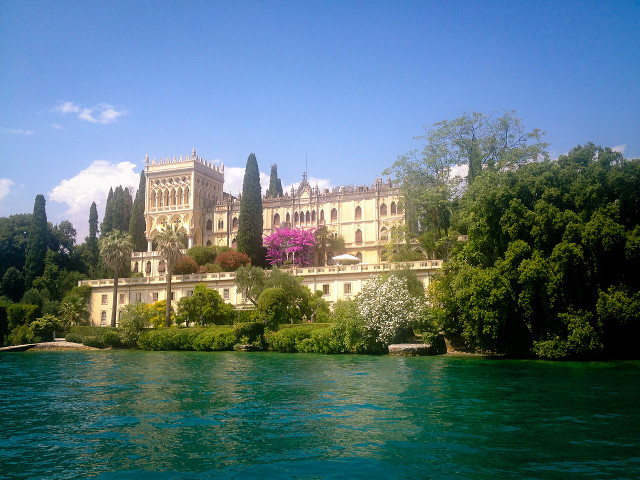 Large building hill lake trees free wallpaper for desktop - medium preview image