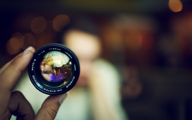 Person holding camera lens blurry #4 free wallpaper for desktop - medium preview image