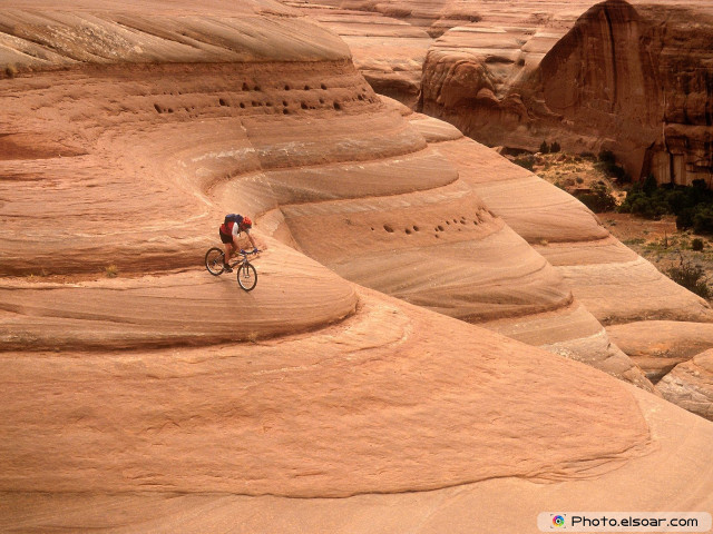Man riding bike desert cliff free wallpaper for desktop - medium preview image