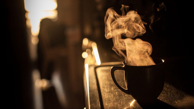 Steaming cup coffee counter light free wallpaper for desktop - medium preview image
