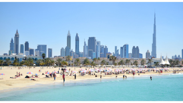 Beach people city tall buildings free wallpaper for desktop - medium preview image