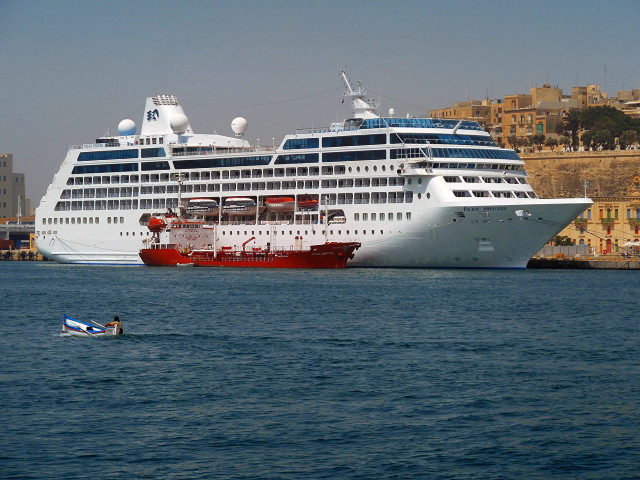 Cruise ship man small boat free wallpaper for desktop - medium preview image