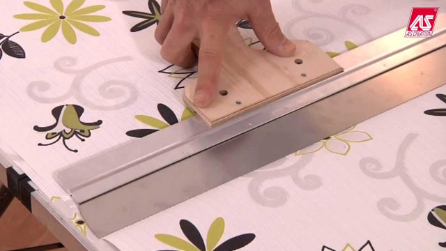 Person stamping flowered tablecloth with free wallpaper for desktop - medium preview image