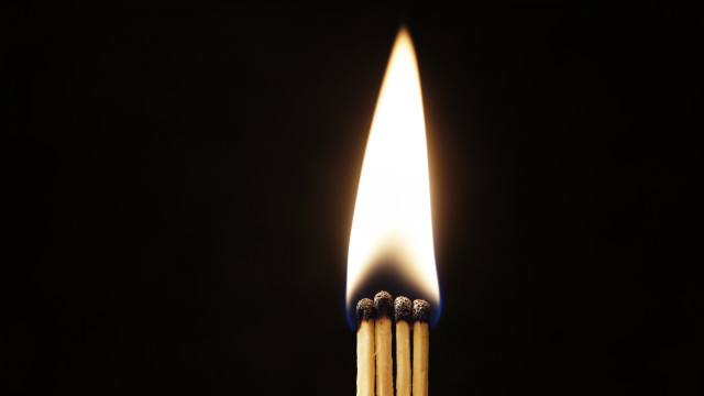 Matchstick lit dark flame between free wallpaper for desktop - medium preview image
