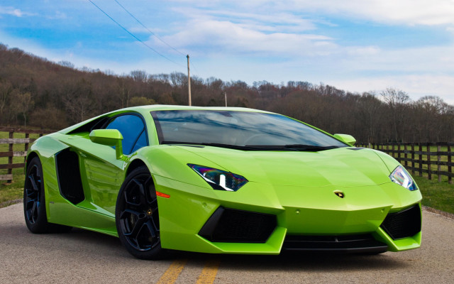 Green sports car parked road free wallpaper for desktop - medium preview image