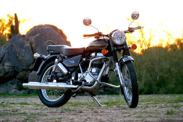 Motorcycle parked field rock sunset free wallpaper for desktop - medium preview image