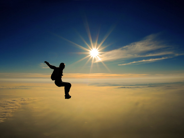 Man jumping high sky sun free wallpaper for desktop - medium preview image
