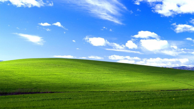 Green field blue sky hill free wallpaper for desktop - medium preview image