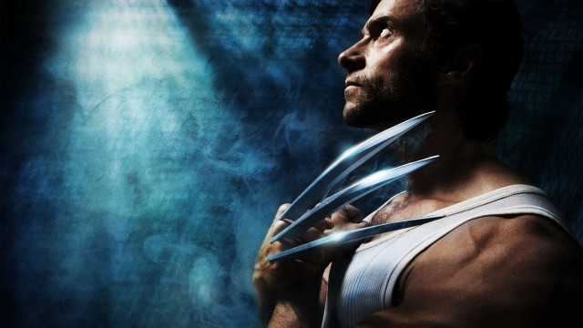 Man holding scissors blue background free wallpaper for desktop - medium preview image