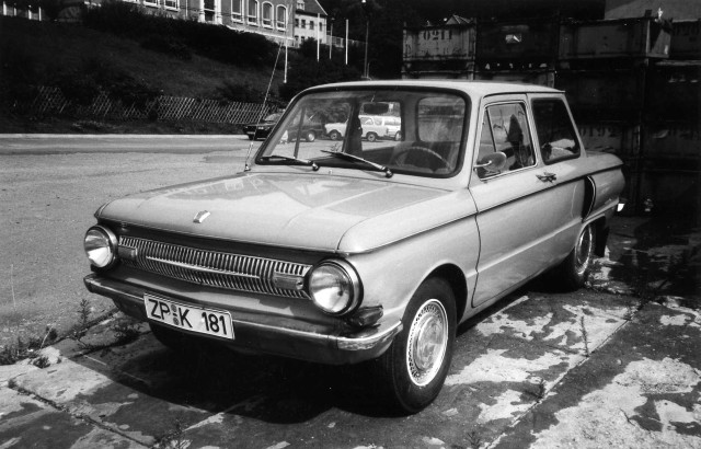 Small car parked road building free wallpaper for desktop - medium preview image