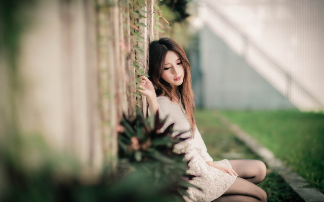 Woman sitting ground wall plant free wallpaper for desktop - medium preview image
