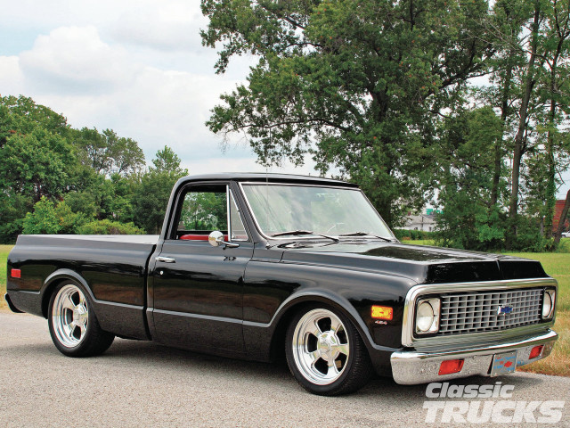 Black truck parked road tree free wallpaper for desktop - medium preview image