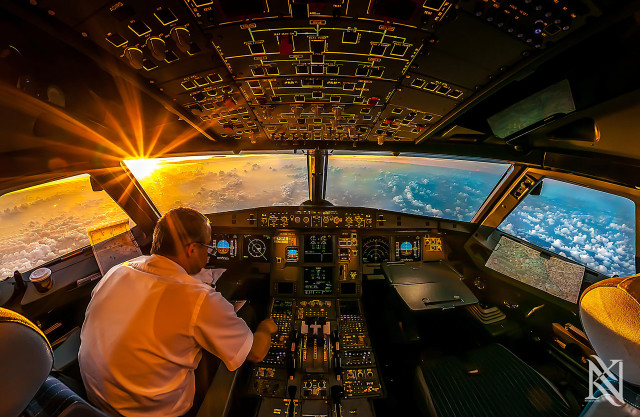 Man sitting cockpit plane view free wallpaper for desktop - medium preview image