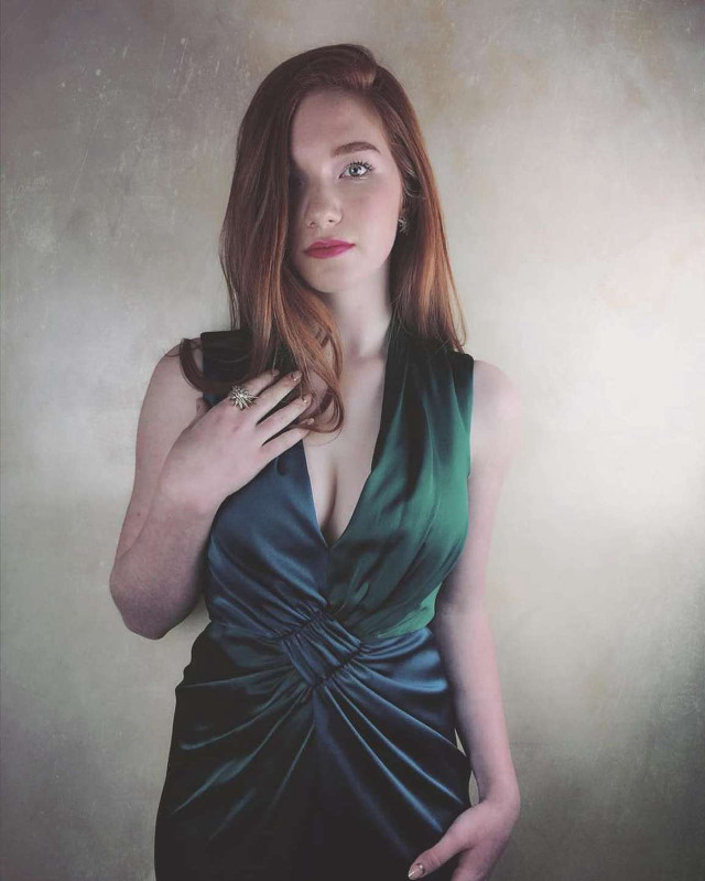 Woman green dress posing hands free wallpaper for mobile - medium preview image