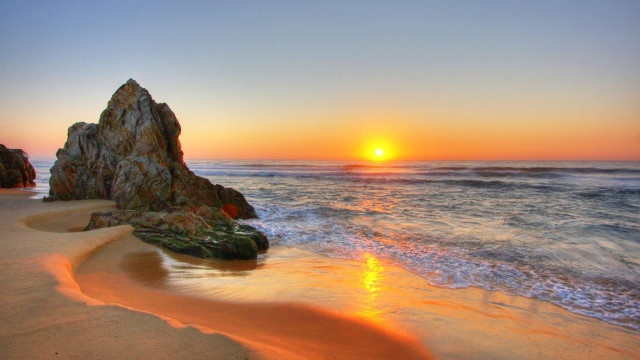 Sunset ocean rock formation beach free wallpaper for desktop - medium preview image