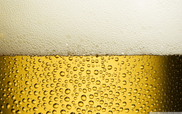 Beer closeup waterdrops yellow black free wallpaper for desktop - medium preview image
