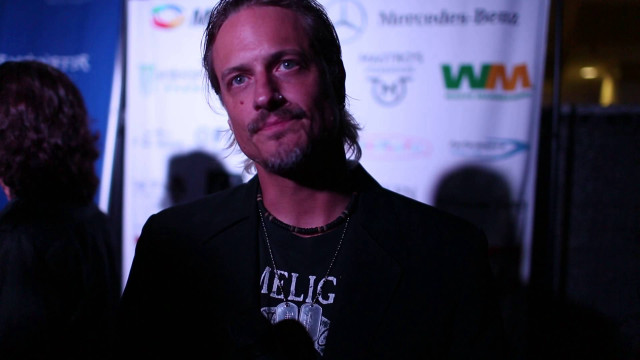 Man beard black shirt wall free wallpaper for desktop - medium preview image