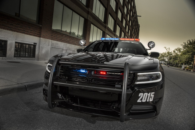 Police car parked road building free wallpaper for desktop - medium preview image
