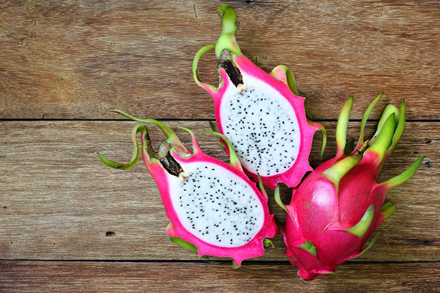 Dragon fruit halves wooden table free wallpaper for desktop - medium preview image