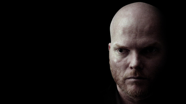 Bald man beard black shirt free wallpaper for desktop - medium preview image