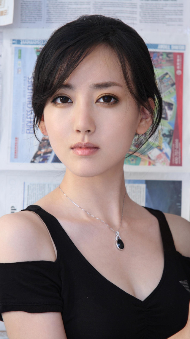 Woman black shirt necklace magazine free wallpaper for mobile - medium preview image