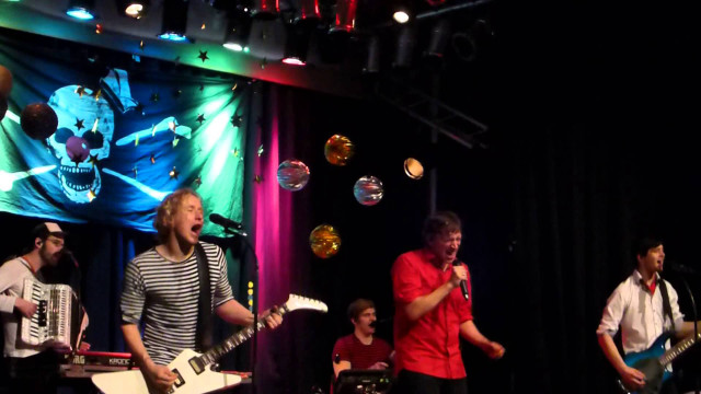 Stage guitarists performance microphone banner free wallpaper for desktop - medium preview image