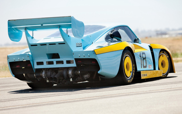 Blue yellow racecar road grass free wallpaper for desktop - medium preview image