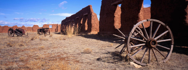 Wagon wheel desert adobe buildings free wallpaper for desktop - medium preview image