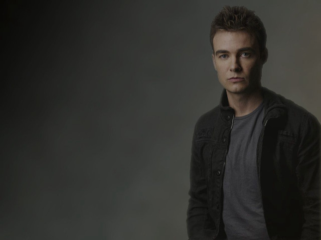 Man black jacket posing picture free wallpaper for desktop - medium preview image