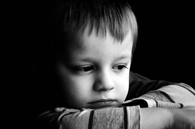Young boy concerned looking over free wallpaper for desktop - medium preview image