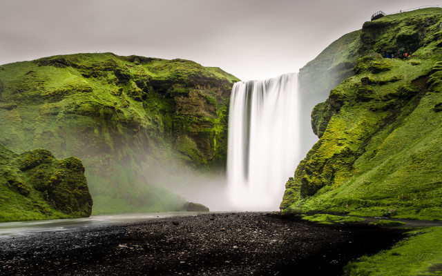 Waterfall black sand beach person free wallpaper for desktop - medium preview image