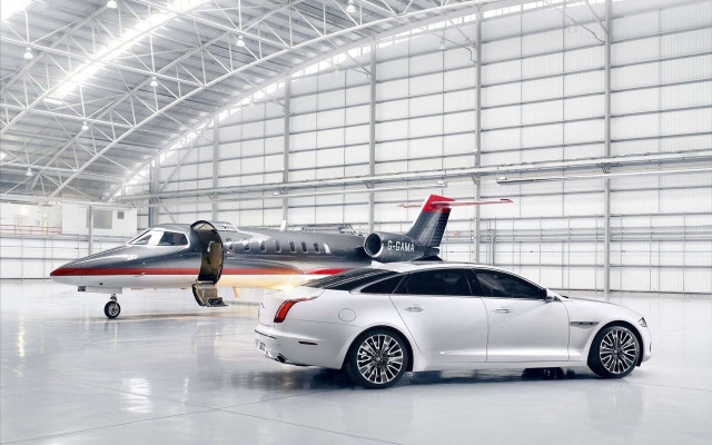 White car parked jet hangar free wallpaper for desktop - medium preview image