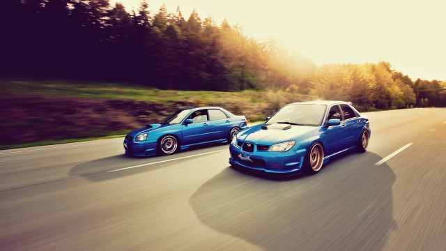 Two cars driving road forest free wallpaper for desktop - medium preview image