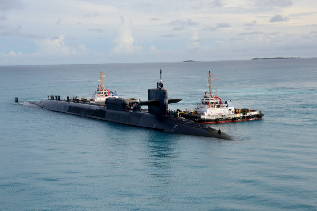 Submarine tugboat ocean cloudy sky free wallpaper for desktop - medium preview image
