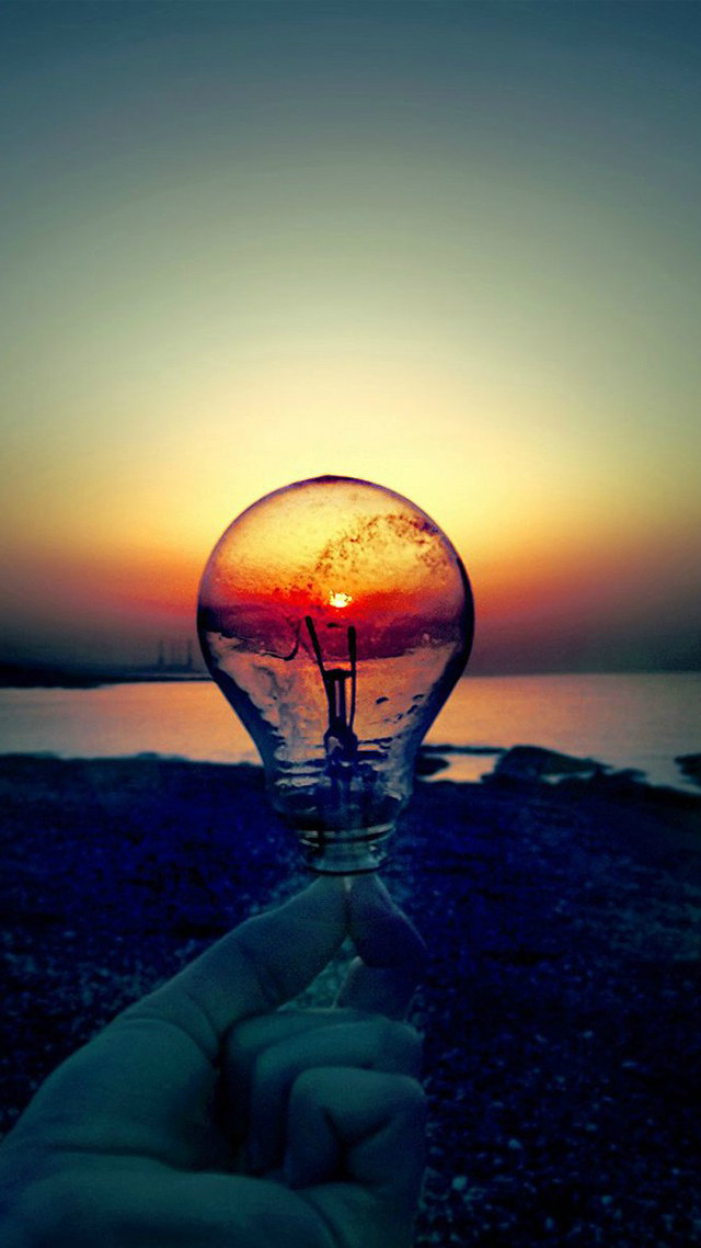 Hand lightbulb sunset water background free wallpaper for mobile - medium preview image