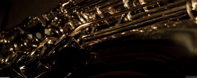 Saxophone closeup black background blurry free wallpaper for desktop - medium preview image