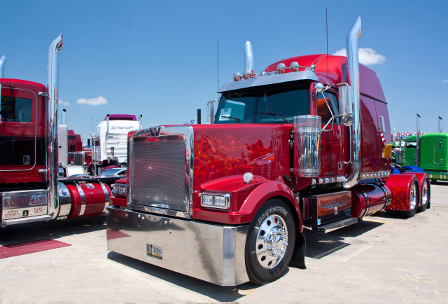 Red semi truck lot sunny free wallpaper for desktop - medium preview image