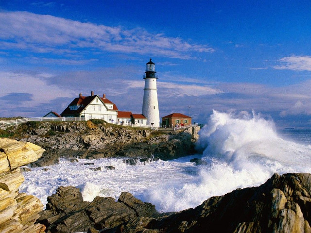 Lighthouse rocky shore crashing wave free wallpaper for desktop - medium preview image