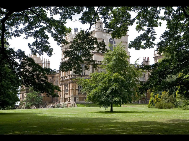 Large building tower tree grassy free wallpaper for desktop - medium preview image